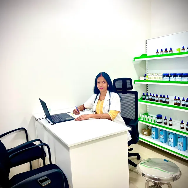Dr. Anisha at her consultation desk at Healing Touch Homeopathy